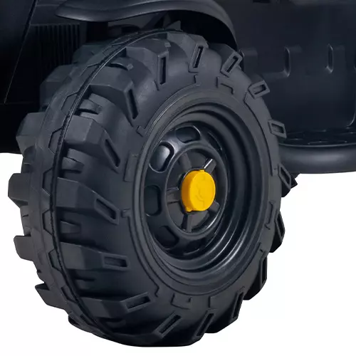 Schwarz-gelbe Reifen mit Profil des Elektro-Kindertraktors