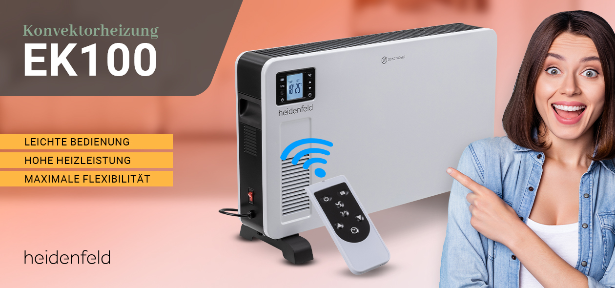 Frau deutet strahlend mit dem Zeigefinger auf die Elektroheizung inklusive Fernbedienung