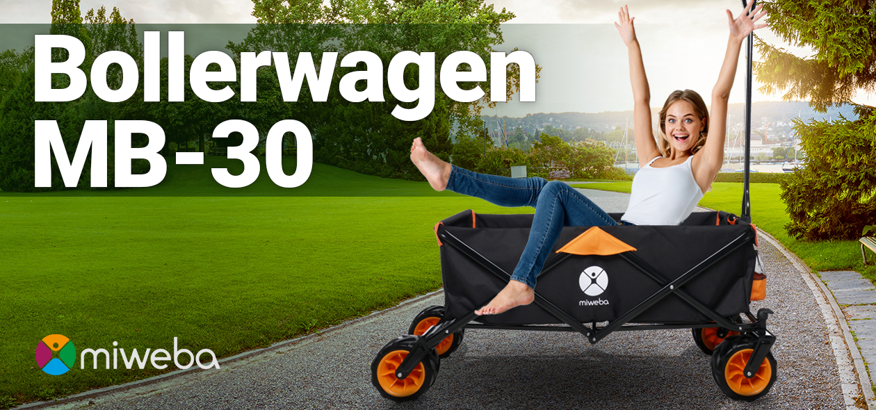Miweba Bollerwagen MB-30 Frau sitzt im Miweba Bollerwagen MB-30 auf Kiesweg und wirft Arme in die Luft